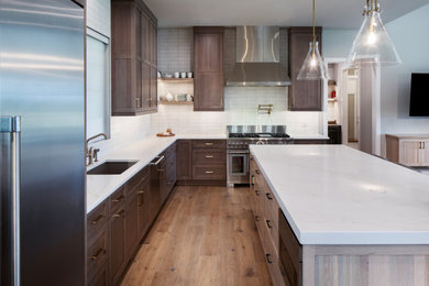 Example of a transitional kitchen design in Denver