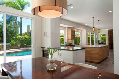 Great room - huge mediterranean dark wood floor and brown floor great room idea in San Diego with white walls