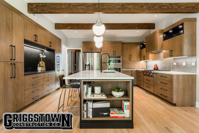 Inspiration for a mid-sized modern l-shaped medium tone wood floor, brown floor and vaulted ceiling eat-in kitchen remodel in Other with a single-bowl sink, flat-panel cabinets, medium tone wood cabinets, quartzite countertops, white backsplash, ceramic backsplash, stainless steel appliances, an island and white countertops