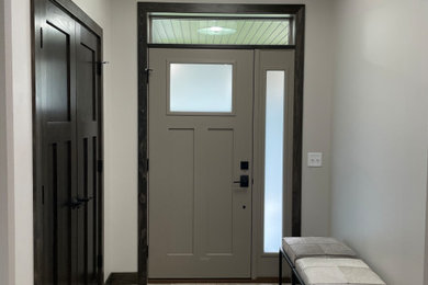 Example of a mid-sized minimalist single front door design in Other with a white front door