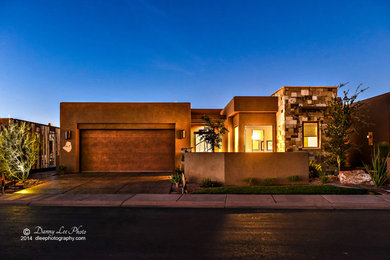 Example of a mid-sized transitional brown one-story stone exterior home design in Other