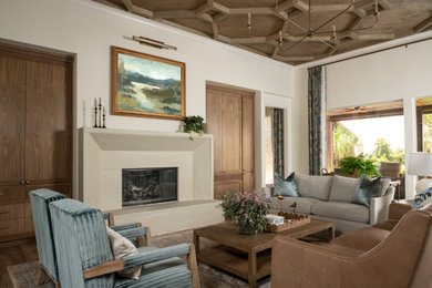 Example of a mid-sized tuscan open concept porcelain tile, brown floor and coffered ceiling living room design in Houston with white walls, a standard fireplace and a stone fireplace