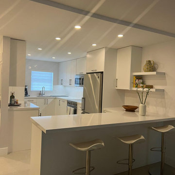 Transitional Kitchen Remodel Done in a Satin White Slim Shaker Door