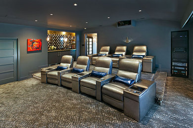Large eclectic enclosed carpeted and multicolored floor home theater photo in San Francisco with blue walls and a projector screen