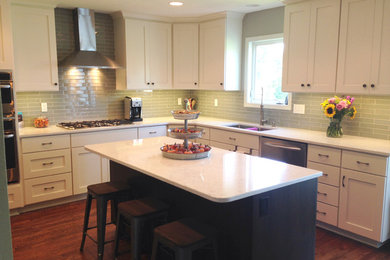 Example of an arts and crafts eat-in kitchen design in Other with shaker cabinets, white cabinets and an island