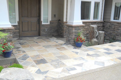 Inspiration for a mid-sized transitional beige exterior in Seattle with stone veneer.