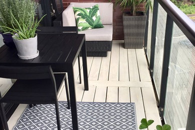 Balcony - small modern balcony idea in Toronto with no cover