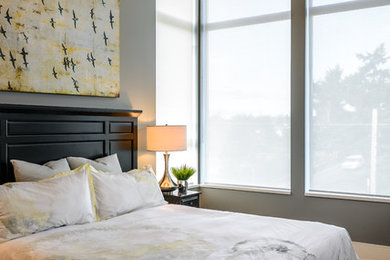 Inspiration for a contemporary bedroom in Vancouver with grey walls, carpet and no fireplace.
