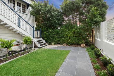 Photo of a traditional home design in Brisbane.