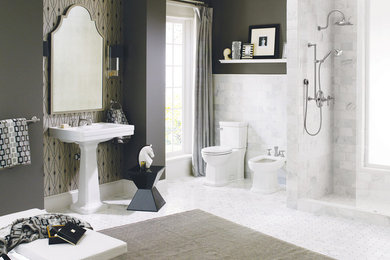 Example of a trendy master gray tile and stone tile marble floor alcove shower design in Orange County with a bidet, gray walls and a pedestal sink