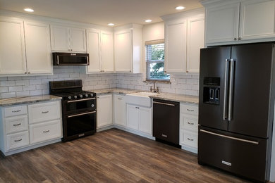Kitchen - farmhouse vinyl floor and multicolored floor kitchen idea in Other with marble countertops, white backsplash, subway tile backsplash and multicolored countertops