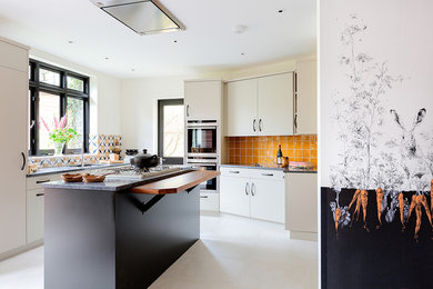 Design ideas for a traditional kitchen in London with ceramic splashback.