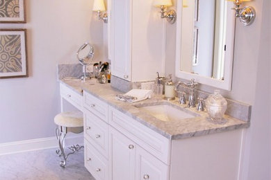 Photo of a mid-sized traditional master bathroom in Atlanta with flat-panel cabinets, white cabinets, a freestanding tub, a double shower, a two-piece toilet, gray tile, stone tile, grey walls, marble floors, an undermount sink and marble benchtops.