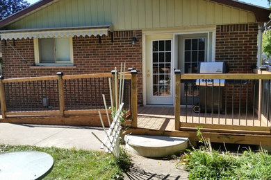Small arts and crafts backyard deck photo in Toronto