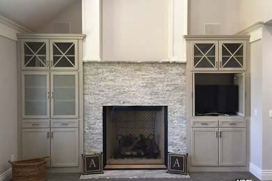 Huge elegant master carpeted and gray floor bedroom photo in Other with gray walls, a standard fireplace and a stone fireplace