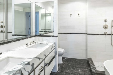 Bathroom - contemporary master white tile multicolored floor bathroom idea in New York with flat-panel cabinets, white cabinets and an undermount sink