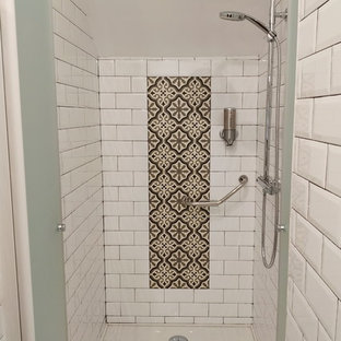 Small 3/4 white tile and subway tile marble floor and white floor wet room photo in Other with open cabinets, black cabinets, an urinal, white walls, a vessel sink, granite countertops, a hinged shower door and black countertops