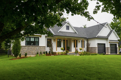 Example of a farmhouse exterior home design in Toronto