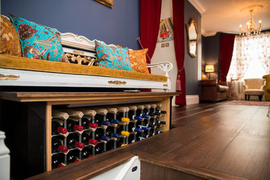 Photo of a medium sized eclectic formal living room in London with blue walls, dark hardwood flooring and brown floors.