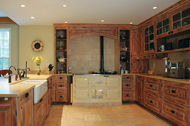 Example of a large cottage u-shaped porcelain tile and beige floor open concept kitchen design in DC Metro with a farmhouse sink, raised-panel cabinets, distressed cabinets, beige backsplash, stone tile backsplash, colored appliances and yellow countertops