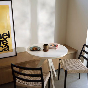 Minimalist ADU Dining Detail with Pendant Light and Built-In Seating