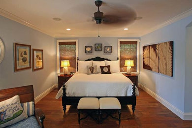 This is an example of a beach style bedroom in Tampa with blue walls.