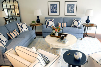 Inspiration for a mid-sized transitional open concept medium tone wood floor living room remodel in Baltimore with gray walls, no fireplace and no tv