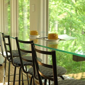 Floating glass breakfast bar with a view