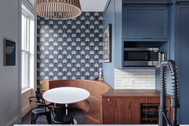 Example of a transitional kitchen design in New York