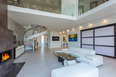 Living room - modern open concept bamboo floor living room idea in Los Angeles with white walls, a standard fireplace and no tv