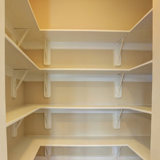 Mid-sized craftsman kitchen pantry photos - Example of a mid-sized arts and crafts u-shaped ceramic floor kitchen pantry design in DC Metro with a single-bowl sink, shaker cabinets, white cabinets, quartzite countertops, white backsplash, ceramic backsplash, stainless steel appliances and an island