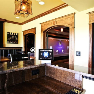 Photo of a medium sized traditional enclosed home cinema in Grand Rapids with beige walls, a projector screen and travertine flooring.