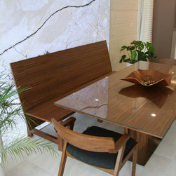 Walnut Dining Bench in front of back-lit stone panel - Products