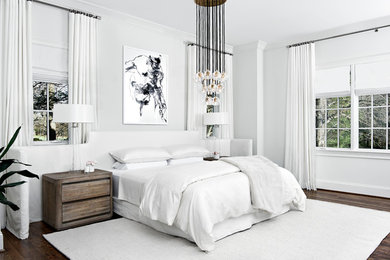 Large trendy master dark wood floor and brown floor bedroom photo in Nashville with white walls and no fireplace
