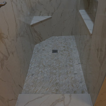 White gold and grey marble bathroom remodel