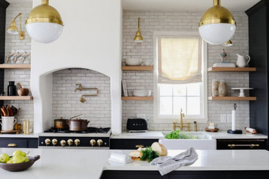 Inspiration for a mid-sized kitchen remodel in Nashville with marble countertops, beige backsplash, ceramic backsplash, an island and white countertops