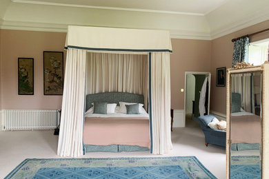 This is an example of a farmhouse bedroom in Gloucestershire.