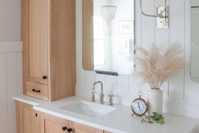 Inspiration for a timeless porcelain tile, gray floor, double-sink and shiplap wall bathroom remodel in Minneapolis with shaker cabinets, light wood cabinets, white walls, an undermount sink, quartzite countertops and a built-in vanity