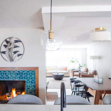 Kitchen fireplace and connected spaces to gather