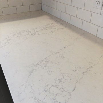 LG Viatera countertops in Muse, Rittenhouse Square subway tiles by Dal-tile