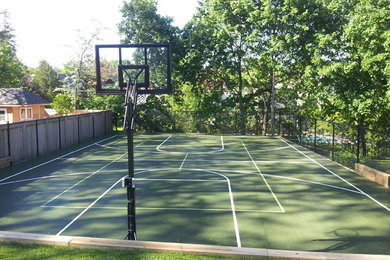 Inspiration for a mid-sized modern partial sun backyard concrete paver landscaping in Toronto for summer.