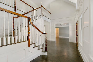 Entryway - mid-sized cottage brown floor entryway idea in New York with white walls