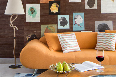 Example of a trendy concrete floor living room design in Miami with brown walls