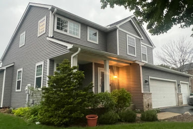 Inspiration for a mid-sized gray two-story house exterior remodel in Minneapolis
