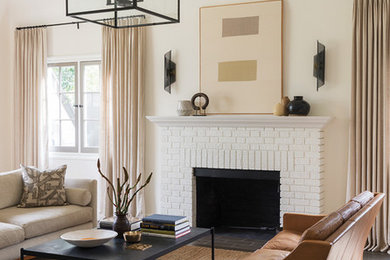 Family room - mid-sized transitional enclosed brown floor family room idea in Toronto with white walls, a standard fireplace, a brick fireplace and no tv
