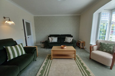 This is an example of a large traditional games room in Sussex with carpet and wallpapered walls.