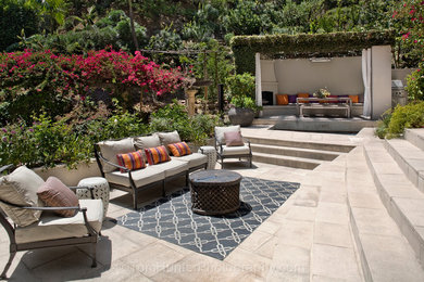 Expansive traditional backyard patio in Los Angeles with a gazebo/cabana.