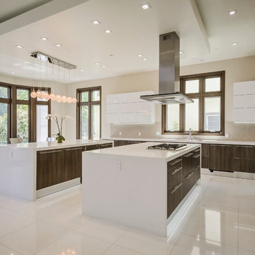 Stainless steel appliances and two islands with prep area