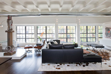 Example of an urban living room design in DC Metro with a concealed tv