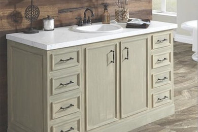 Freestanding bathtub - mid-sized traditional master vinyl floor and beige floor freestanding bathtub idea in DC Metro with recessed-panel cabinets, beige cabinets, brown walls, a drop-in sink and marble countertops